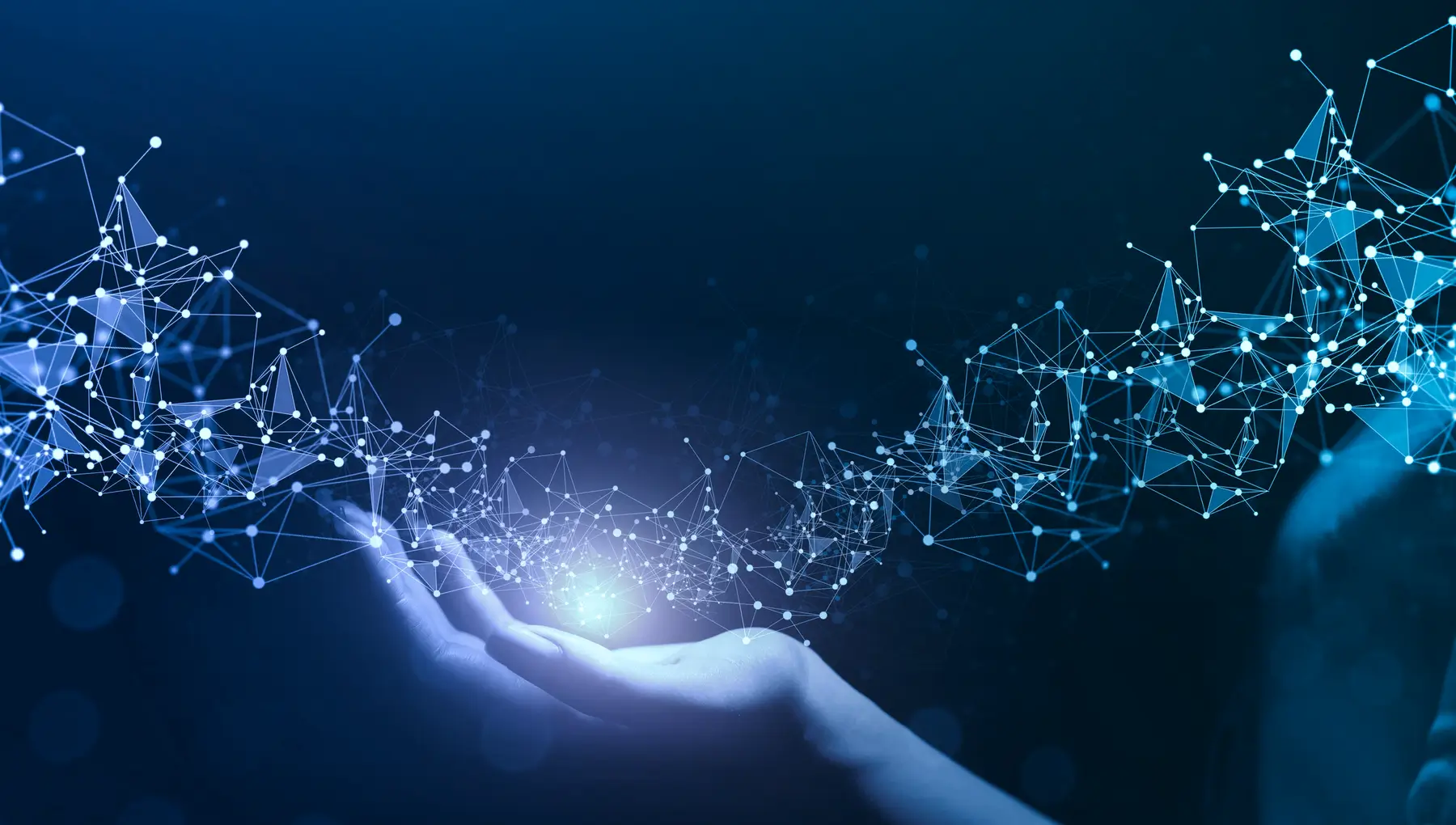 A hand is held open with blue glowing connected lines and dots forming a network pattern above it on a dark background, symbolizing AI and data strategy.